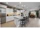 Spacious kitchen boasts granite countertops, stainless steel appliances, and an island with seating at 17848 E Stocking Trl, Rio Verde, AZ 85263