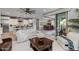 Open concept living room with kitchen and dining area views at 17848 E Stocking Trl, Rio Verde, AZ 85263
