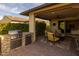 Outdoor kitchen with built-in grill and stone countertops at 17848 E Stocking Trl, Rio Verde, AZ 85263