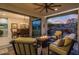 Relaxing patio with fire pit and comfortable seating, offering views of the backyard at 17848 E Stocking Trl, Rio Verde, AZ 85263