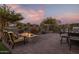 Covered patio with fire pit and comfortable seating at 17848 E Stocking Trl, Rio Verde, AZ 85263