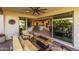 Covered patio with sliding glass doors opening to kitchen and living areas at 17848 E Stocking Trl, Rio Verde, AZ 85263