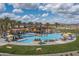 Resort-style pool with comfortable lounge chairs and shade structures at 17848 E Stocking Trl, Rio Verde, AZ 85263
