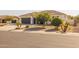 Single-story home with a two-car garage and desert landscaping at 18341 W San Juan Ave, Litchfield Park, AZ 85340