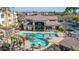 Aerial view showing refreshing pool and clubhouse with surrounding landscaping at 18416 N Cave Creek Rd # 1042, Phoenix, AZ 85032