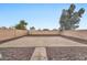 Large backyard with gravel and a small patio area at 18963 N Vemto St, Maricopa, AZ 85138