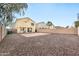 Spacious backyard with gravel and a covered patio at 18963 N Vemto St, Maricopa, AZ 85138