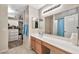 Double sink bathroom vanity with a large mirror and ample storage at 18963 N Vemto St, Maricopa, AZ 85138