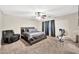Comfortable bedroom with carpeted floor and an en-suite bathroom at 18963 N Vemto St, Maricopa, AZ 85138