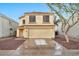 Two-story house with a two-car garage and well-maintained landscaping at 18963 N Vemto St, Maricopa, AZ 85138