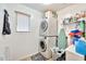Laundry room with washer, dryer, and shelving at 18963 N Vemto St, Maricopa, AZ 85138