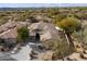 Aerial view of single-story home with a tile roof and desert landscaping at 19910 N 84Th St, Scottsdale, AZ 85255