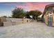 Outdoor BBQ area with built-in grill and fireplace at 19910 N 84Th St, Scottsdale, AZ 85255