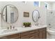 Bright bathroom features double vanities, sleek fixtures, and marble accents for a modern, luxurious space at 19910 N 84Th St, Scottsdale, AZ 85255