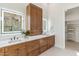 Bathroom featuring double sinks, white countertops, and decorative lighting at 19910 N 84Th St, Scottsdale, AZ 85255