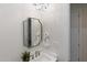 Elegant powder room with chandelier and decorative mirror at 19910 N 84Th St, Scottsdale, AZ 85255