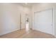 Spacious bedroom with hardwood floors and access to another room at 19910 N 84Th St, Scottsdale, AZ 85255