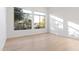 Light-filled bedroom with hardwood floors and large windows at 19910 N 84Th St, Scottsdale, AZ 85255