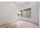 Bright bedroom with hardwood floors and corner windows at 19910 N 84Th St, Scottsdale, AZ 85255