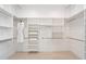 Large walk-in closet with ample shelving and hanging space at 19910 N 84Th St, Scottsdale, AZ 85255
