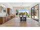 Bright dining room featuring built-in storage and an incredible view of the outdoor landscaping at 19910 N 84Th St, Scottsdale, AZ 85255