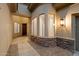 Elegant entryway with stone accents and a view of the interior at 19910 N 84Th St, Scottsdale, AZ 85255