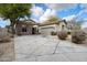 Single-story home with stone accents and a two-car garage at 19910 N 84Th St, Scottsdale, AZ 85255