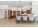 Spacious kitchen boasts a center island with barstool seating and modern lighting fixtures at 19910 N 84Th St, Scottsdale, AZ 85255