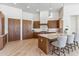 Kitchen featuring custom wood cabinets, stainless appliances, and an island with seating at 19910 N 84Th St, Scottsdale, AZ 85255