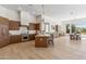 Open kitchen featuring stainless steel appliances, center island, and breakfast bar seating at 19910 N 84Th St, Scottsdale, AZ 85255