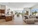 Open concept living space seamlessly connects the kitchen, dining area and sitting room at 19910 N 84Th St, Scottsdale, AZ 85255