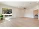 Bright living room with hardwood floors and large window at 19910 N 84Th St, Scottsdale, AZ 85255