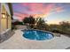 Inviting pool and spa area with a stunning sunset view at 19910 N 84Th St, Scottsdale, AZ 85255