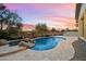 Luxury pool and spa with a waterfall feature at 19910 N 84Th St, Scottsdale, AZ 85255