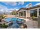 Relaxing pool and spa surrounded by large stones at 19910 N 84Th St, Scottsdale, AZ 85255