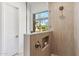 Sleek shower design with a window and built-in niche, showcasing modern functionality at 19910 N 84Th St, Scottsdale, AZ 85255
