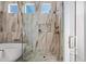 Spa-like shower with marble tile and modern fixtures at 19910 N 84Th St, Scottsdale, AZ 85255
