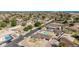 Overhead view of a home with an in-ground pool, situated within a welcoming neighborhood setting at 2037 E Riviera Dr, Tempe, AZ 85282