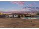 A backyard pool is surrounded by a fence and has a covered patio area nearby at 2037 E Riviera Dr, Tempe, AZ 85282