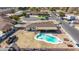 An aerial shot of a backyard pool and patio area with a fence at 2037 E Riviera Dr, Tempe, AZ 85282