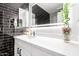 Modern bathroom with black tile and white vanity at 2037 E Riviera Dr, Tempe, AZ 85282