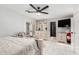 Main bedroom with a king-size bed, dresser, and access to the backyard at 2037 E Riviera Dr, Tempe, AZ 85282