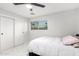 Bedroom with a single bed and white closet at 2037 E Riviera Dr, Tempe, AZ 85282