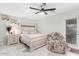 Bright bedroom with a king-size bed, nightstand and ceiling fan at 2037 E Riviera Dr, Tempe, AZ 85282