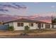This single-story home has a well-manicured lawn and mature landscaping at 2037 E Riviera Dr, Tempe, AZ 85282