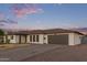 A beautiful single-story home with a well-manicured lawn and large driveway at 2037 E Riviera Dr, Tempe, AZ 85282
