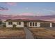 Charming home exterior with a well-maintained yard at sunset at 2037 E Riviera Dr, Tempe, AZ 85282