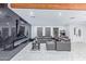 Open concept living room with a modern fireplace and large sectional at 2037 E Riviera Dr, Tempe, AZ 85282