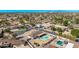 An aerial shot of a neighborhood with mature trees and a community park at 2037 E Riviera Dr, Tempe, AZ 85282