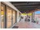 Covered patio with brick flooring and access to backyard at 2037 E Riviera Dr, Tempe, AZ 85282